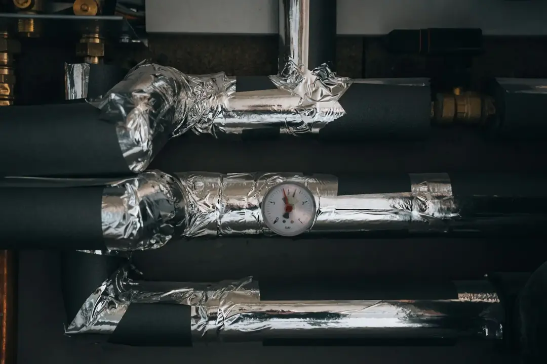 Insulated commercial heating pipes and pressure gauge